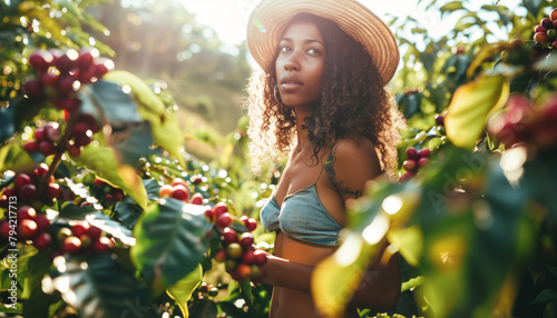 Young mixed race woman in straw hat standing next to bushes with red coffee berries, picker farmer working at planation. Generative AI photo
