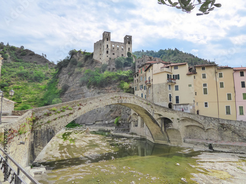 Scenic view of famous Castle Castello dei doria and ancient roman bridge ponte vecchio over river Nervia in remote village Dolceaqua, Province of Imperia in the Italian region Liguria, Italy, Europe photo