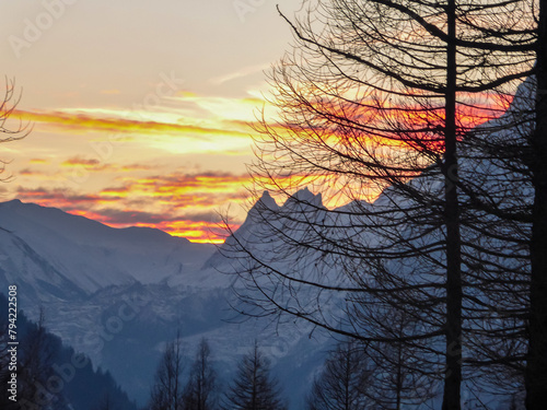 Beautiful sunset view of snow capped Mont Blanc mountain range massif in Alps seen from remote alpine cottage near Courmayeur, Aosta Valley, Italy, Europe. Graian Alps on watershed France and Italy