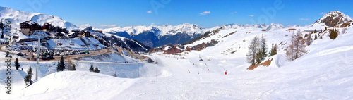 Panoramic view of the ski slopes of the famous La Plagne-village ski resort in the heart of the French Alps in the Tarentaise valley at the foot of Mont Blanc photo