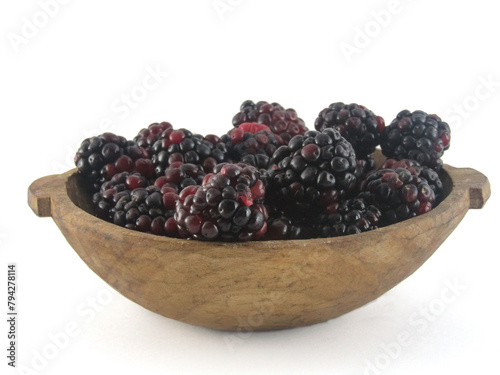 blackberry in wooden bowl white background