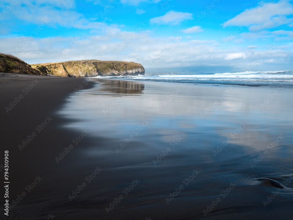 Fototapeta premium The black sand Santa Barbara beach on San Miguel, Azores, well known surfing spot. 