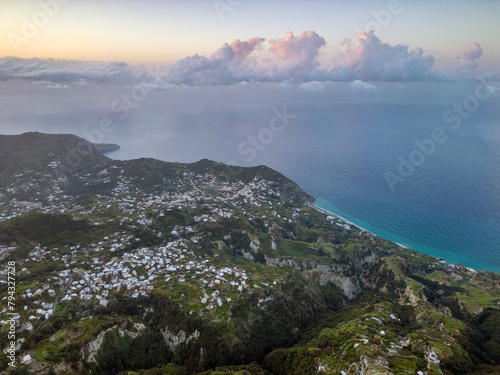 Vista aerea all’alba dal monte Epomeo a Ischia. Volo tra le nuvole con vista mare photo