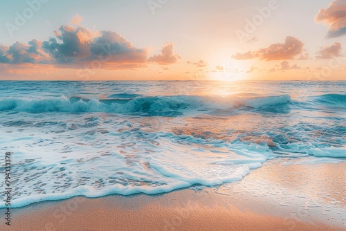 Sunrise over a beach with waves gently breaking on sandy shore.
