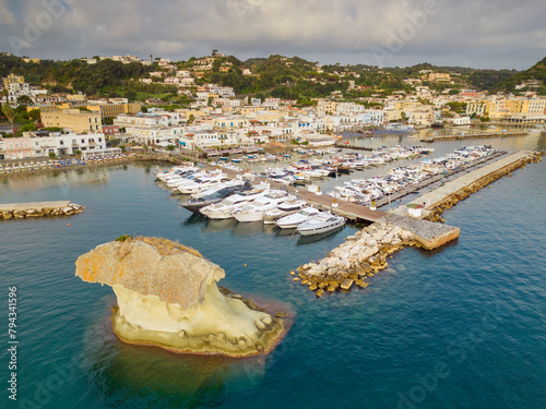 Aerial sunrise view of the port of Lacco Ameno in Ischia. Rock, sea, sun and a thousand colors photo