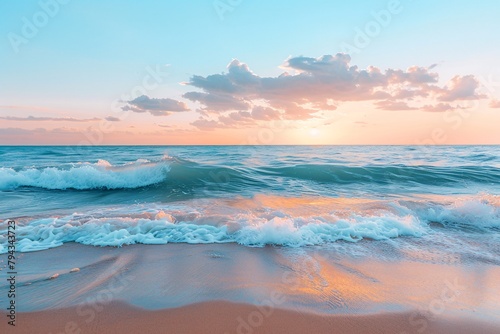 Sunset over a tranquil beach  waves gently crashing  clear sky with soft clouds.