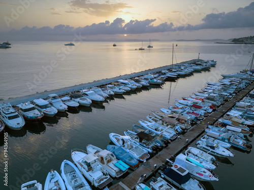 Vista aerea dell'alba del porto di Lacco Ameno ad Ischia. Roccia, mare, sole e mille colori photo