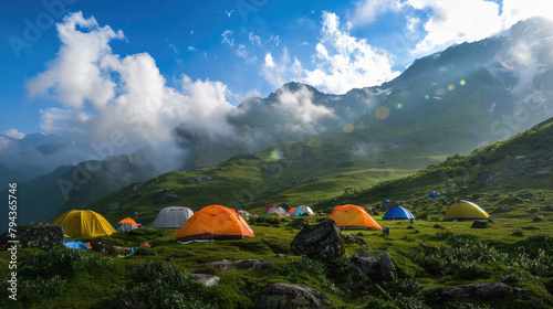 A group of colorful tents are set up in a grassy field