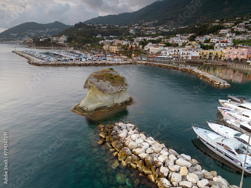 Vista aerea dell'alba del porto di Lacco Ameno ad Ischia. Roccia, mare, sole e mille colori photo