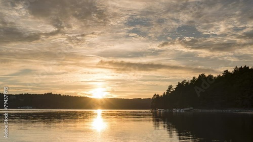 Sunset Timelapse with orange light, orange sky, and reflection in water from Correze, Neuvic