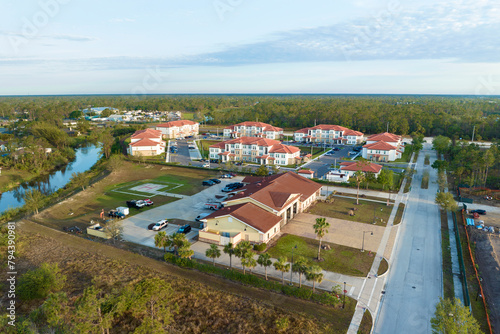 Aerial view of american apartment buildings in Florida residential area. New family condos as example of housing development in US suburbs