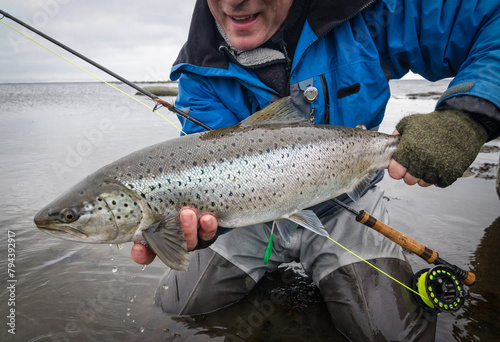 Beautiful sea trout on the fly rod photo
