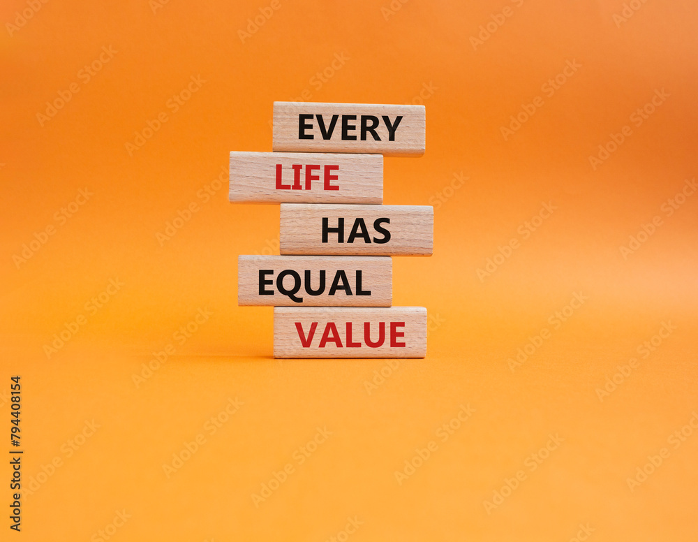 Naklejka premium Equality symbol. Wooden blocks with words Every Life has Equal Value. Beautiful orange background. Equality and life concept. Copy space.