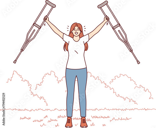 Woman with axillary crutches rejoices in recovery health legs and opportunity not to use auxiliary medical equipment. Girl gets rid of armpit crutches after undergoing rehabilitation in hospital