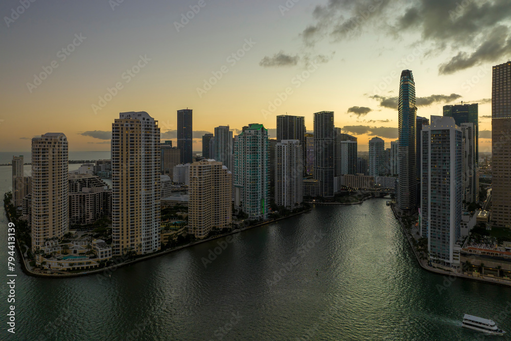 View from above of high skyscraper buildings in downtown district of Miami Brickell in Florida, USA at sunset. American megapolis with business financial district at nightfall View from above of high skyscraper buildings in downtown district of Miami Brickell in Florida, USA at sunset. American megapolis with business financial district at nightfall