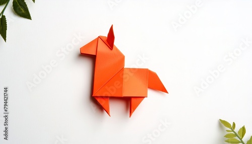 Animal concept origami isolated on white background of an orange horse - Equus caballus - with copy space side view of mane and tail, simple starter craft for kids