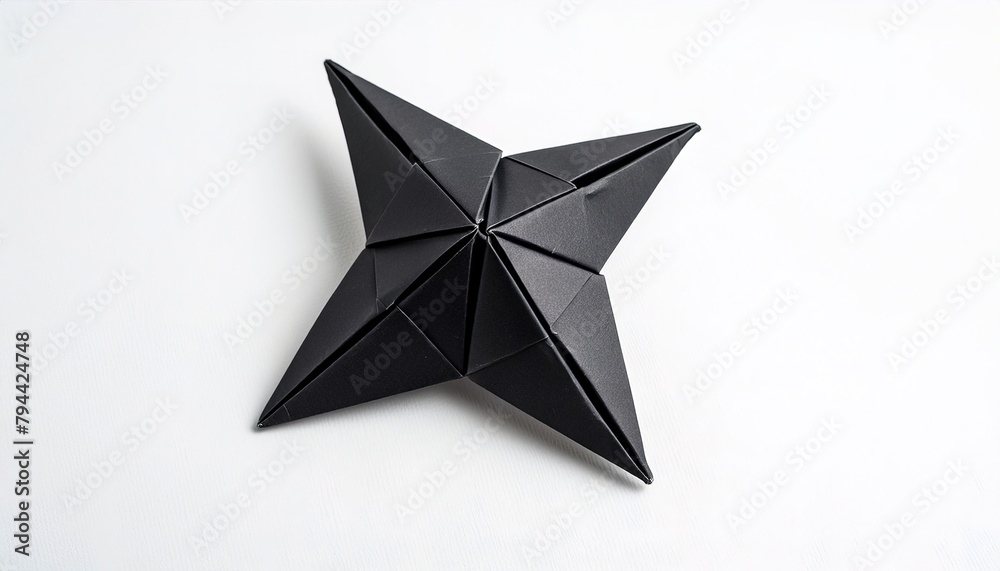 Ninja Shuriken star weapon black paper origami star weapon isolated on white background simple starter craft for kids for weekend entertainment Ninja Shuriken star weapon black paper origami star weapon isolated on white background simple starter craft for kids for weekend entertainment