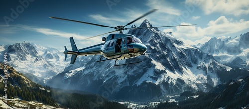 Helicopter flying over the mountains. photo