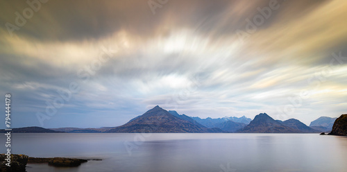The Cuillin Mountains Isle Of Skye Scotland taken from Elgol at Sunset with stunning clouds above the mountain peaks photo