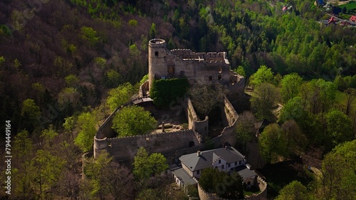 Medieval Chojnik Castle atop Karkonosze mountain in aerial shot. © Grzegorz