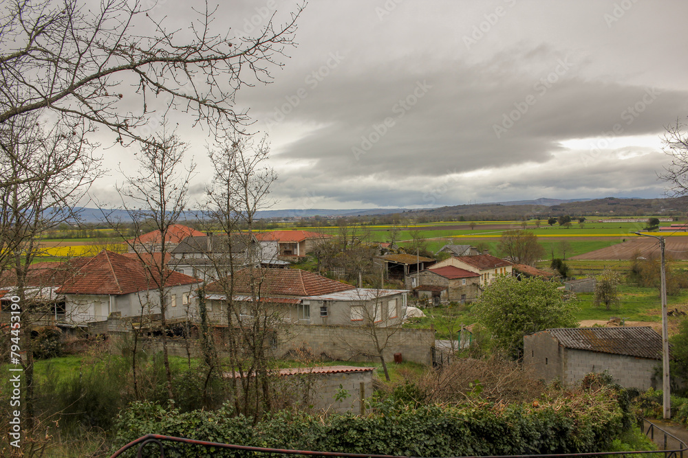 village in Galicia, Spain, with yellow fields