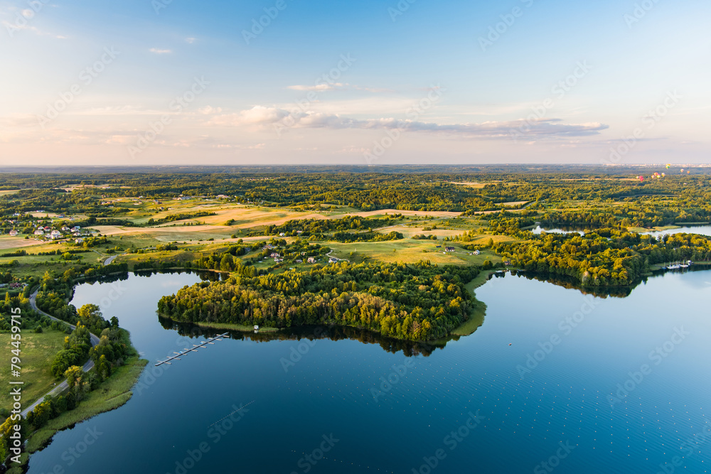 Fototapeta premium Beautiful aerial view of lake Galve, favourite lake among water-based tourists, divers and holiday makers, located in Trakai, Lithuania.