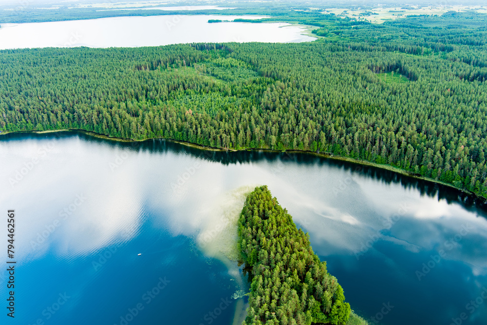 Scenic aerial view of Sciuro Ragas peninsula, separating White Lakajai and Black Lakajai lakes. Picturesque landscape of lakes and forests of Labanoras Regional Park, Lithuania.