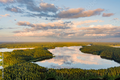 Scenic aerial view of Sciuro Ragas peninsula, separating White Lakajai and Black Lakajai lakes. Picturesque landscape of lakes and forests of Labanoras Regional Park, Lithuania. photo
