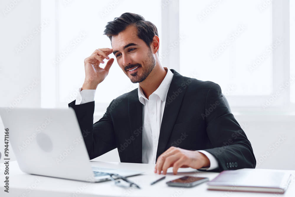 Man in office businessman sitting at desk and working in laptop, finance and startup concept, working lifestyle in bright office. Man in office businessman sitting at desk and working in laptop, finance and startup concept, working lifestyle in bright office.