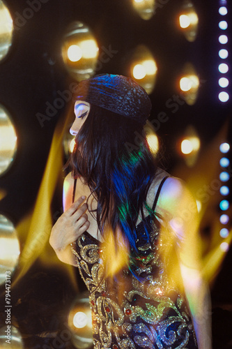 woman dancing in nightclub double exposed with fire