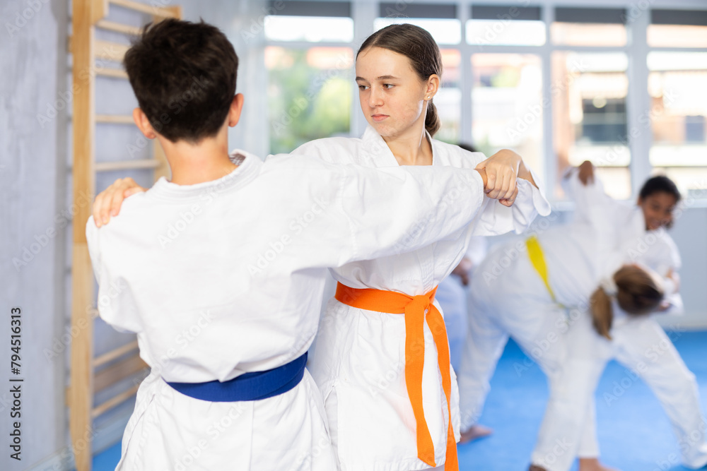 Sparring During Karate Training Of Children Of Different Nationalities sparring-during-karate-training-of-children-of-different-nationalities