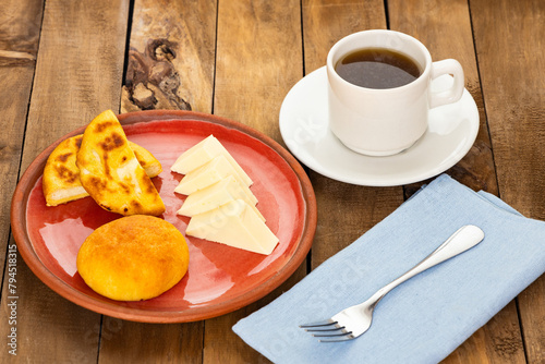 Boyacense breakfast with arepa, cheese, almojabana and aguapanela photo