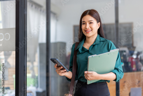 Free Download Young asian woman, professional entrepreneur standing in office clothing, smiling and looking confident, office background - GFXLoad