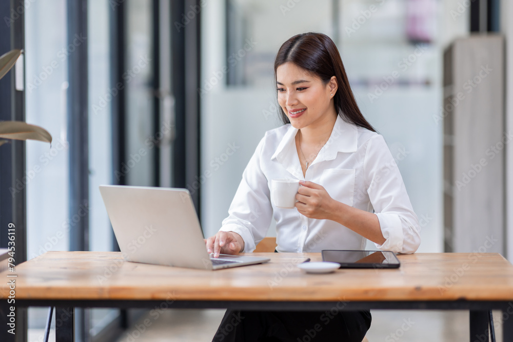 Asian Business woman using calculator and laptop for doing math finance on an office desk, tax, report, accounting, statistics, and analytical research concept
Asian Business woman using calculator and laptop for doing math finance on an office desk, tax, report, accounting, statistics, and analytical research concept