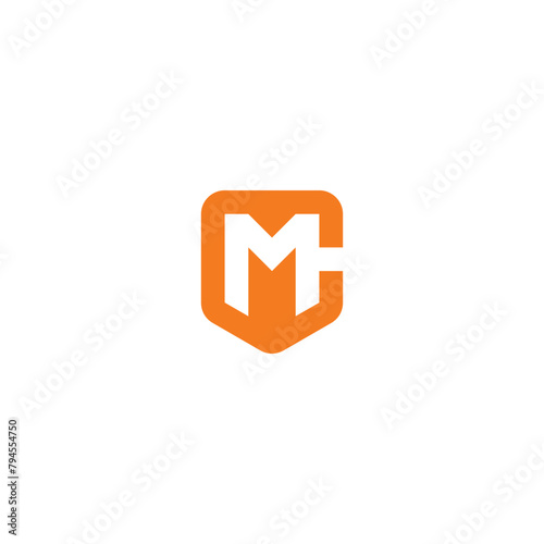MC monogram logo in shield shape.
