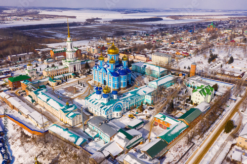 Aerial panoramic view of architectural complex of Nativity of Mother of God Monastery in small Russian town of Zadonsk on winter day.. photo