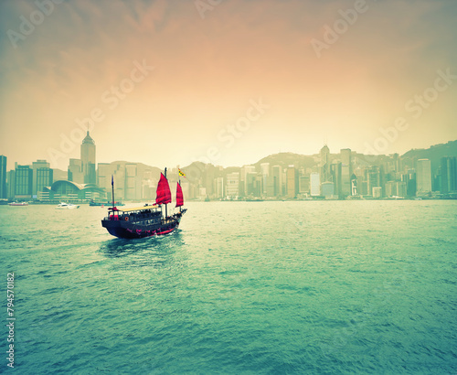 Chinese junk sailing in Victoria Harbour, Hong Kong, China