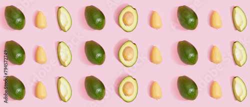 Many fresh ripe avocados on pink background. Pattern for design