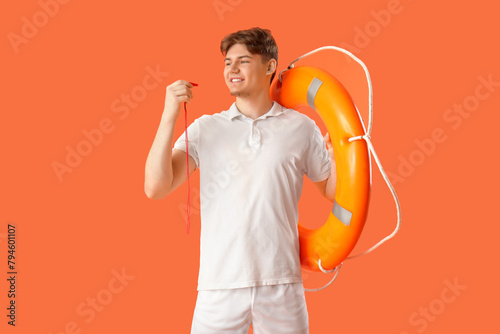 Male lifeguard with ring bu...