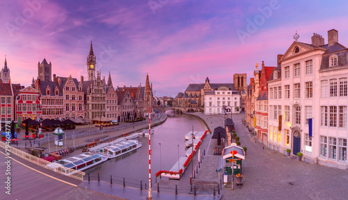 Panoramic aerial view of quay Graslei, Leie river and towers of Old Town, Ghent, Belgium