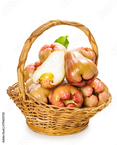 Rose apple tropical fruit with leaf in bamboo basket isolate on white with clipping path.