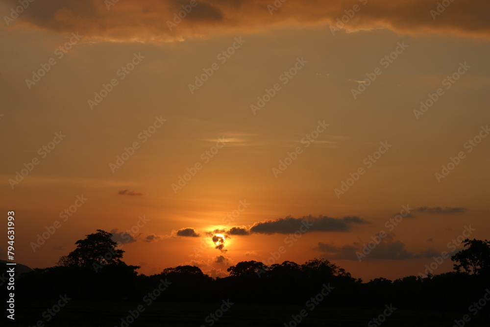 Sunset Sky Clouds in the evening with Red, Orange, Yellow and purple sunlight on Golden hour after sundown, Romantic sky in summer on Dusk Twilight. heart sky. Sunset Sky Clouds in the evening with Red, Orange, Yellow and purple sunlight on Golden hour after sundown, Romantic sky in summer on Dusk Twilight. heart sky.