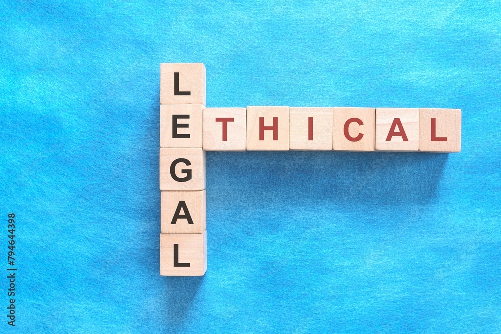 Ethical versus legal concept. Crossword puzzle flat lay in blue background.