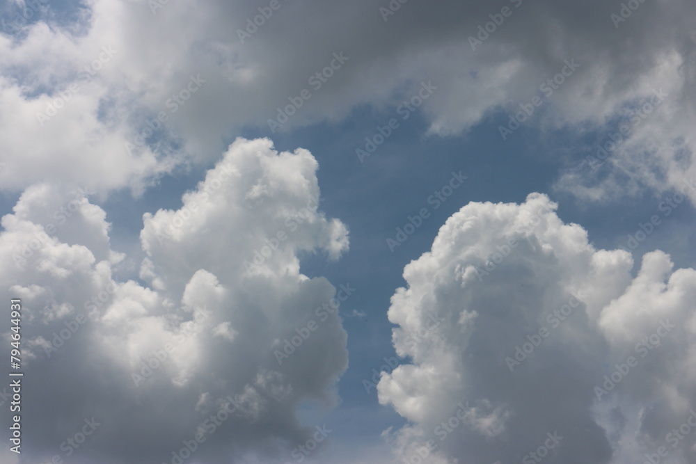 blue sky and white clouds. Freshness of the new day. Bright blue background. Relaxing feeling like being in the sky.
