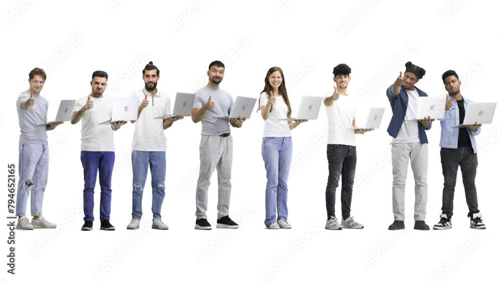 A group of people, full-length, on a white background, show a thumbs up with a laptop A group of people, full-length, on a white background, show a thumbs up with a laptop