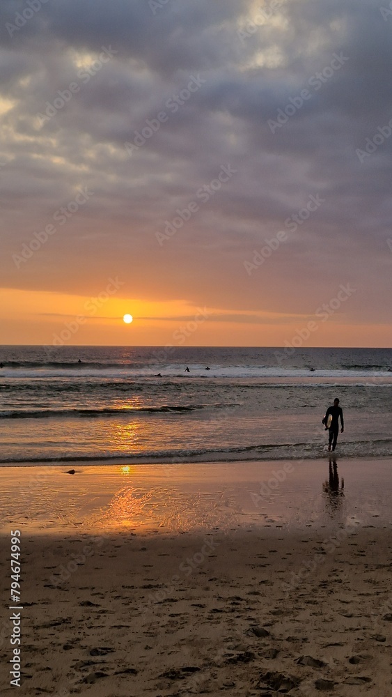 Sunset on the beach. Surfing 