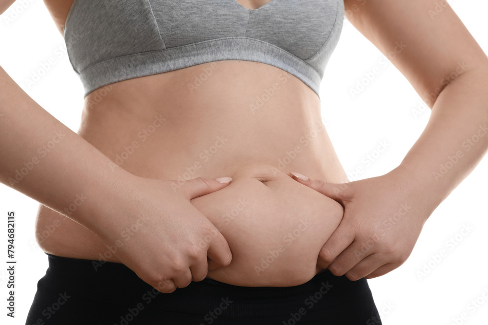 Woman touching belly fat on white background, closeup. Overweight problem