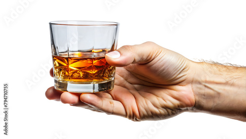 A hand grasps a snifter filled with amber liquid, brandy, whiskey, or cognac