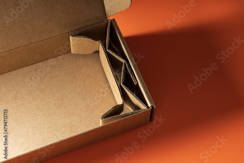 corrugated box with extra layer inside as shock supporter, package cushioning, shock resistant design, packaging for delivery, item protection during shipment, way to lock things in place