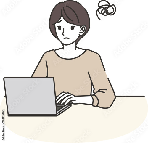 パソコンをしながら困る女性